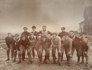 men posed on a football field