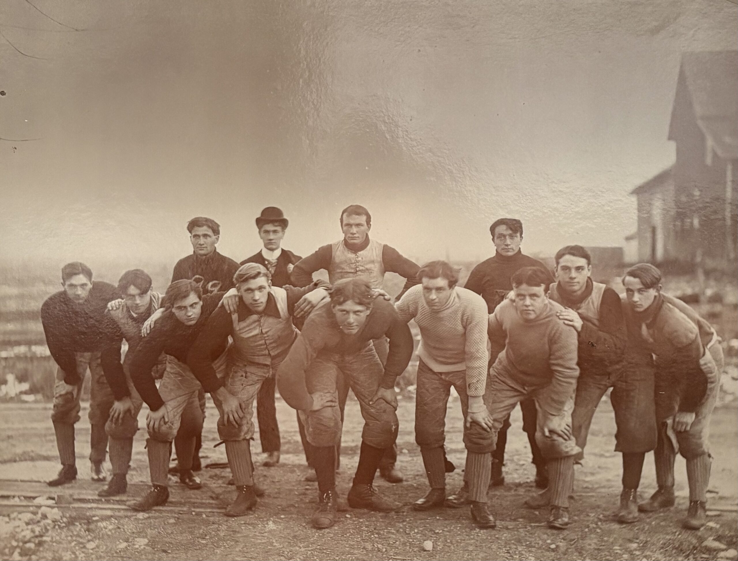 men posed on a football field