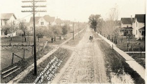 Black and white photo of a dirt road looking west from Copenhagen Street.