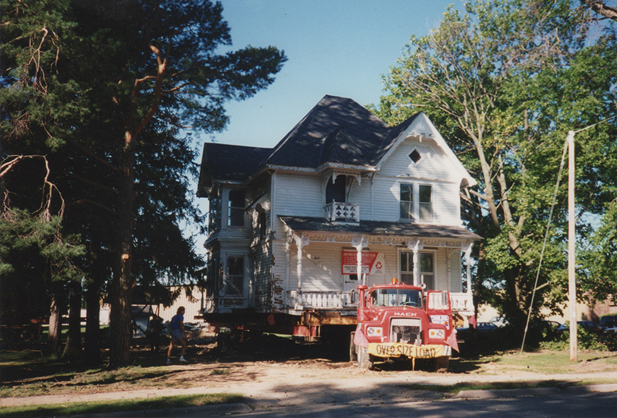 House being moved by a truck.