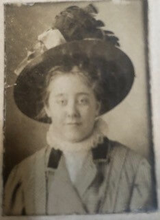 Woman wearing a decorative hat.