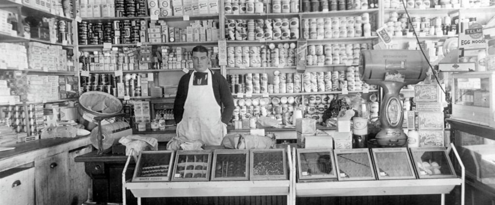 Steve Madsen standing behind the counter.