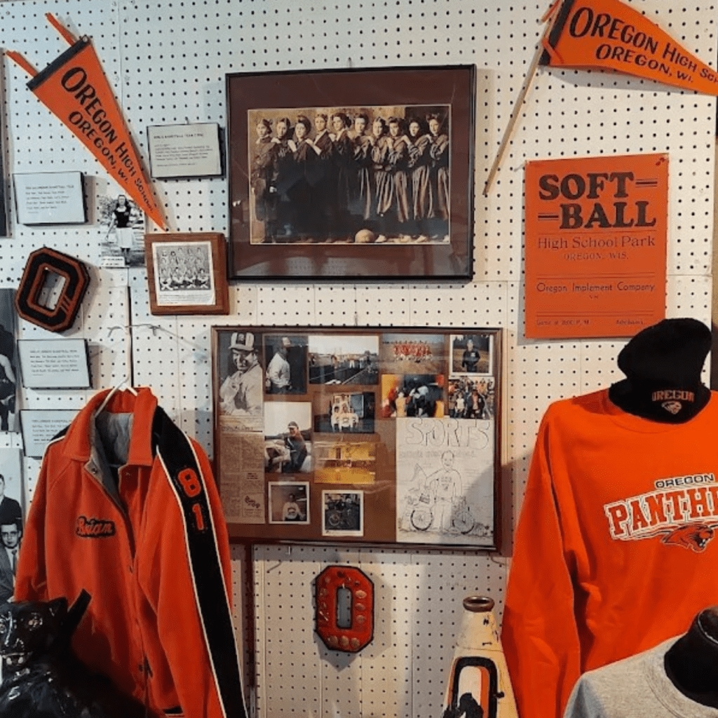 Oregon School District Display with tee shirts, images, banners, and flags from over the years